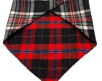 May include: A reversible dog bandana with a black and white plaid pattern on one side and a red and black plaid pattern on the other side.