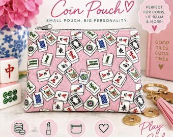 May include: A pink zippered coin pouch featuring a repeating pattern of Mahjong tiles. The pouch is displayed with Mahjong tiles, a gold-toned keychain with a tassel, and text that reads MAHJONG Coin Pouch, SMALL POUCH. BIG PERSONALITY.