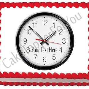 May include: A red and white cake with a black clock on top. The clock face is white with black numbers and hands. The clock face says "8 Your Text Here 4".