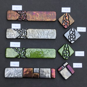 May include: Five rectangular glass tiles with different designs and colors. The tiles are labeled with the text "T 78.P 1", "T 78.P 2", "T 78.P 4", "T 78.P 5", and "T 78.N 1", "T 78.N 2", "T 78.N 4", "T 78.N 5".