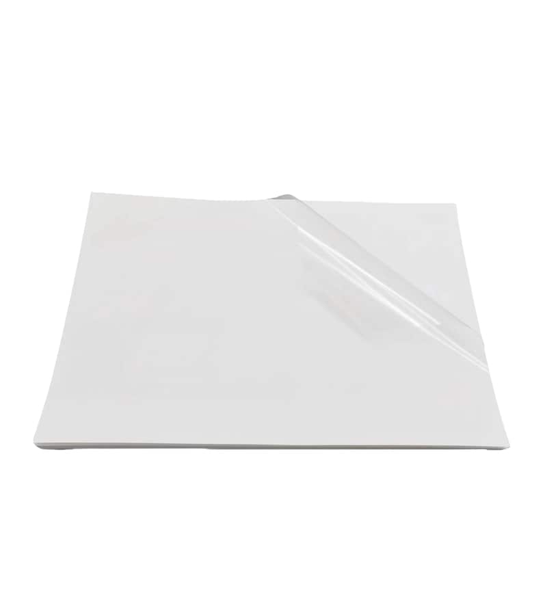May include: A white sheet of paper with a clear plastic sheet on top of it.