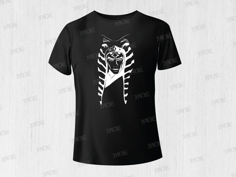May include: Black t-shirt with a white graphic of a woman with a headdress. The woman's face is visible and she has a serious expression.