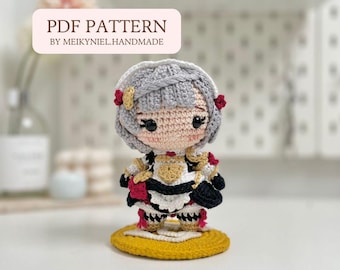 May include: Crochet amigurumi doll with gray hair, red and white dress, and a yellow base. The doll is wearing a black and white dress with a red bow. The doll is standing on a yellow base. The doll is a character from a popular anime. The image includes the text "PDF PATTERN BY MEIKYNIEL.HANDMADE".