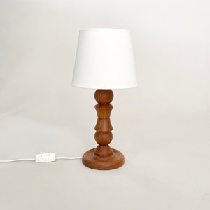 A Swedish mid-century modern turned teak table lamp. Scandinavian 50s 60s design