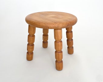A small Swedish pine wood milking stool. Scandinavian mid century modern.