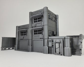 May include: A gray, multi-level building model with a futuristic design. Features include garage doors, barred windows, and exterior details like pipes and an air conditioning unit. The model has a modular design, with a wall and stairs.