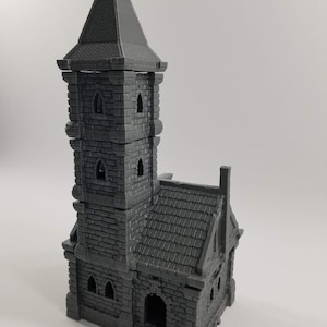 May include: A gray 3D printed model of a stone tower with a pointed roof and a smaller building attached. The tower has three levels with windows and the building has a door and windows.