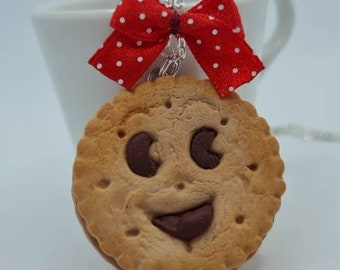 Sautoir biscuit sourire ruban rouge à pois