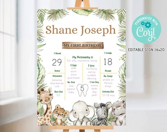 May include: A jungle-themed first birthday sign for a baby named Shane Joseph. The sign features a green and brown color scheme with illustrations of animals like a giraffe, lion, elephant, zebra, and hippopotamus. It includes details like the baby's age, weight, height, and other milestones.