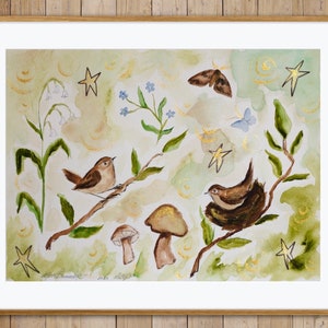 May include: Watercolor painting of a whimsical forest scene with two brown birds perched on branches, surrounded by green leaves, blue flowers, and gold stars. The painting has a light green and yellow background with gold accents.