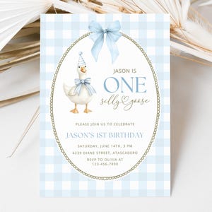 May include: A rectangular birthday invitation card with a light blue and white gingham pattern. It features a central oval frame with a light blue bow, a goose wearing a party hat and bow tie, and text reading JASON IS ONE silly goose, PLEASE JOIN US TO CELEBRATE JASON'S 1ST BIRTHDAY, SATURDAY, JUNE 14TH, 3 PM, 4239 DIANE STREET, ATASCADERO, RSVP TO OLIVIA AT 123-456-7890.
