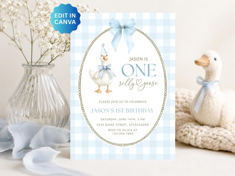 May include: A rectangular birthday invitation card featuring a light blue gingham pattern, a central oval frame with a gold border, and a blue bow at the top. It displays a watercolor goose wearing a party hat and bow, with text reading JASON IS ONE SILLY GOOSE.