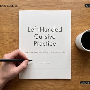 May include: A white workbook titled Left-Handed Cursive Practice with 38 practice pages, built left-first for teens and adults. The cover includes the text 47 pages, Left-Handed Cursive, and Adults & Teens. A black pen is held over the book.