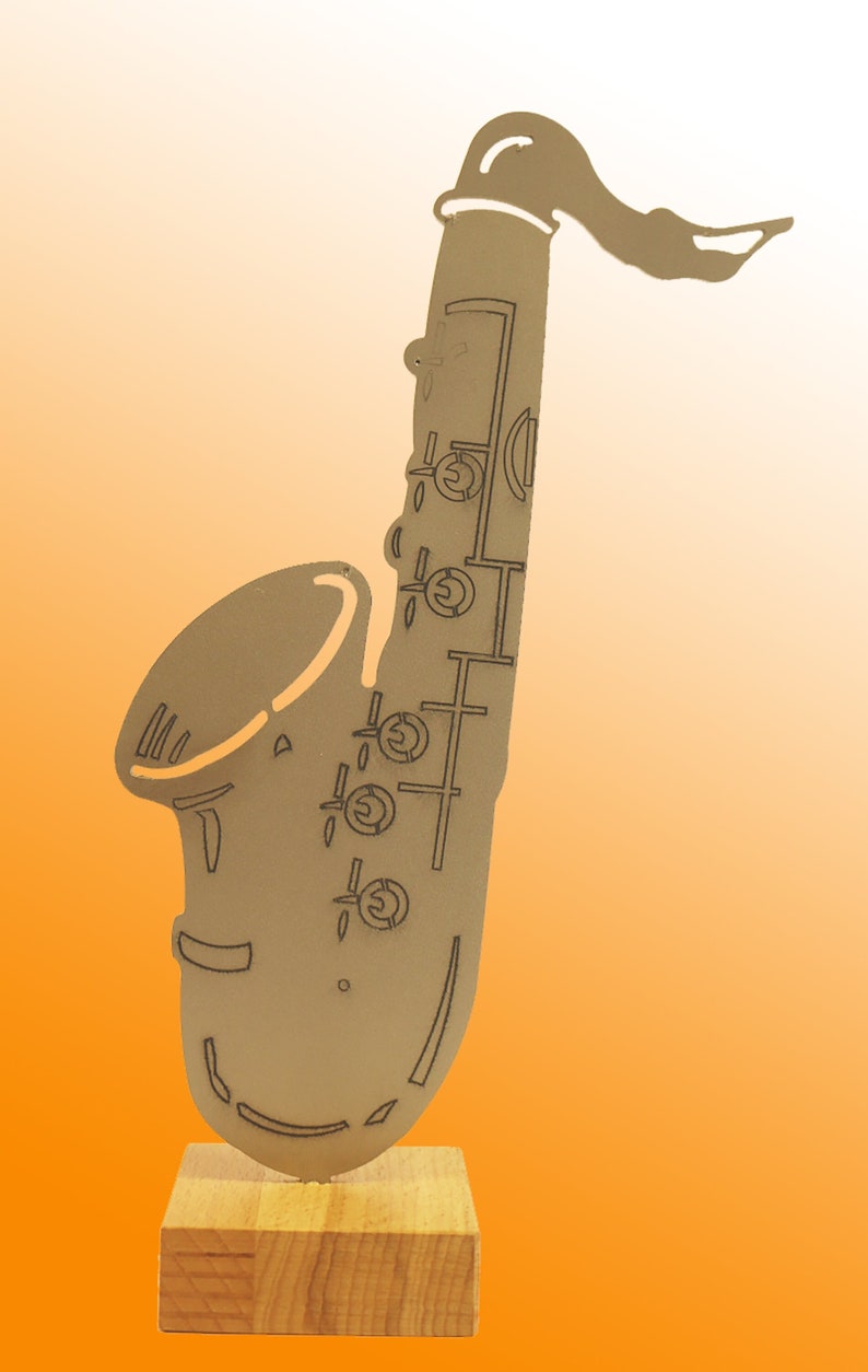 Stainless steel saxophone on wooden base image 1