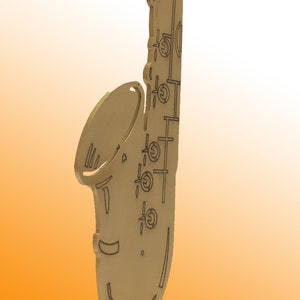 Stainless steel saxophone on wooden base image 2