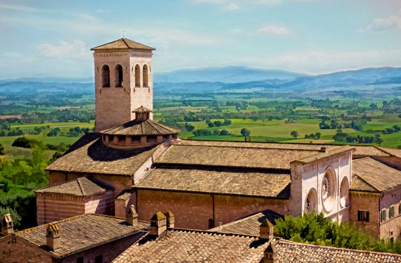 View of St. Peter's Abbey in Assisi, Italy. In the background, the valley of Umbria.