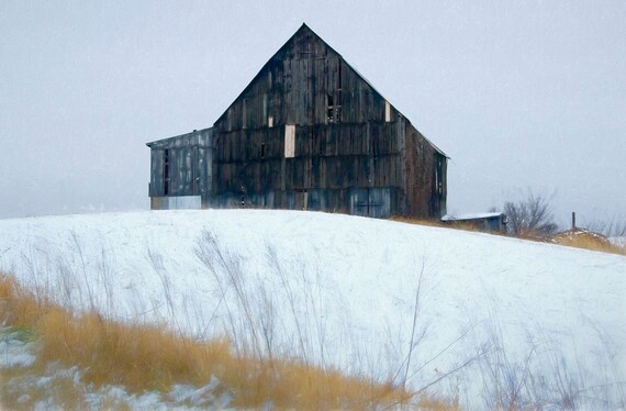 An unpainted barn in a snowstorm, outside Westin, MO.
