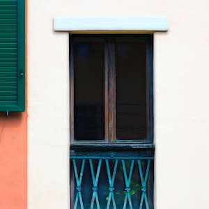 Window and shutters in Bologna, Italy.