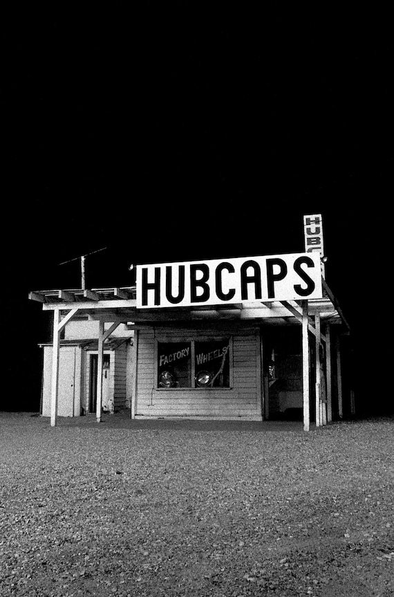 Hubcap store in Saugus, CA, at night.
