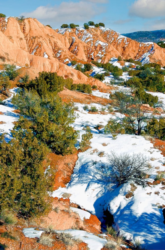 Red sand hills at sunset near Chimayo, New Mexico