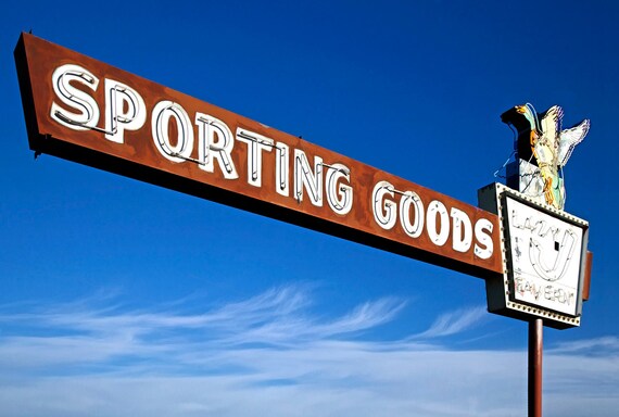 Old neon sporting goods sign, Eagle, ID.