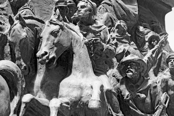 Memorial statue of men fighting with Garibaldi in the Italian Revolution.
