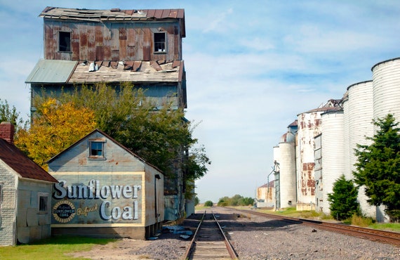 Warehouse and grain silos at rail stop in Kansas.