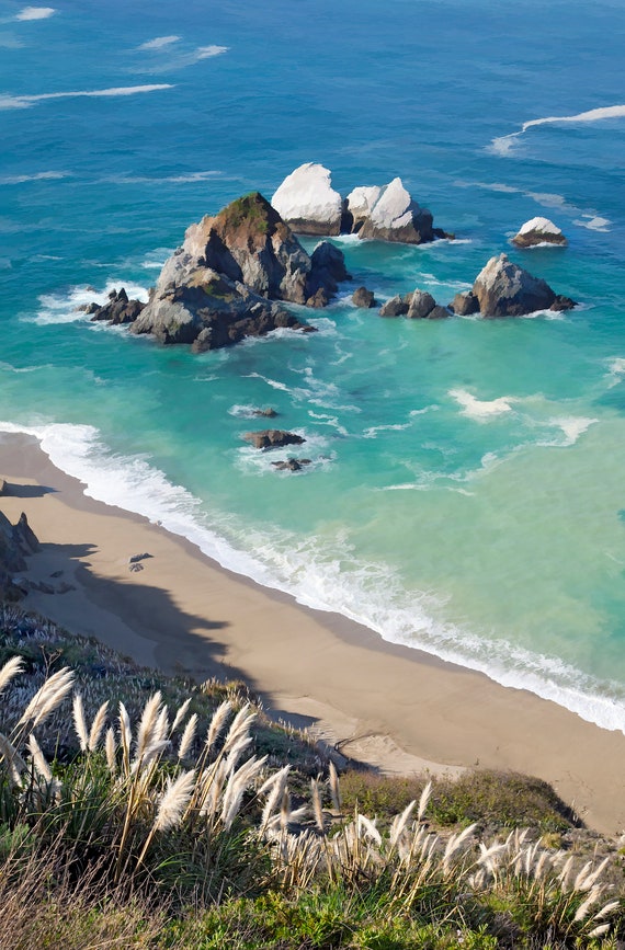Morning sun on a beach near Big Sur, California.
