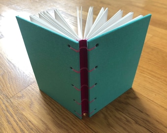 Carnet Tiffany vert et fuchsia A6, housse en tissu et reliure copte