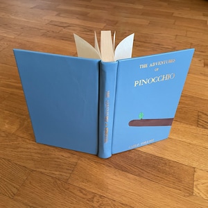 Ferma Libro pinocchiolinea le Fiabiche Di Ghenos-libro in Ceramica Con Base  in Legno 
