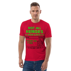 May include: A red short-sleeved t-shirt featuring green text that reads NOT ALL HEROES WEAR CAPES and black text that reads WE EVERY LOGS AT 3AM and SO YOU DON'T HAVE TO, along with a black graphic of a computer window and a coffee mug.