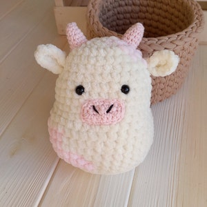 Strawberry cow squishmallow plushie in kawaii style, pink cow, stuffed animals