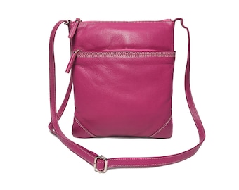 May include: A pink leather crossbody bag with a zippered pocket and a long adjustable strap.