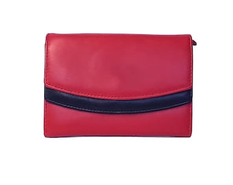 May include: A red leather wallet with a black leather trim. The wallet has a fold-over closure.