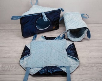 May include: Three blue and black hanging pet beds for small animals. The beds are made of soft fabric and have a variety of shapes and sizes.