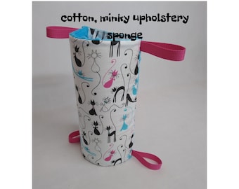 May include: A white cotton and minky fabric pouch with a blue and pink cat print. The pouch has a pink handle and the text "cotton, minky upholstery sponge" is printed on the top.