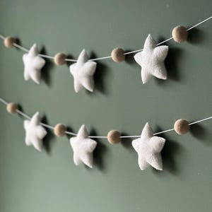 Felt Star Garland: Handmade Nursery Decor with Pom Poms