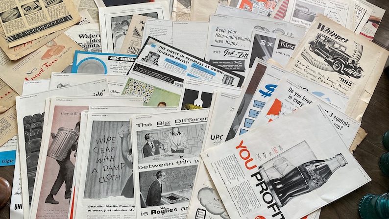 May include: A collection of vintage advertisements and newspaper clippings, featuring various products and services. The ads showcase retro graphics and text, with some featuring the text "New Angel Face" and "Wipe Clean With A Damp Cloth".