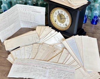 May include: A black antique clock with a gold-colored face and Roman numerals sits among a collection of aged documents and ledgers. The documents include handwritten notes and the text "CONTINENTAL INSURANCE COMPANY."