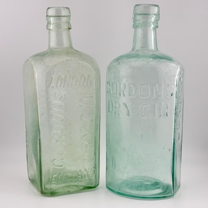 SET OF 2) Antique Alcohol Bottles. Aqua Gordon’s Dry Gin. Embossed Applied Top (BIMAL) - Bottle Lot. Bar Decor, Period Piece Lot. Authentic