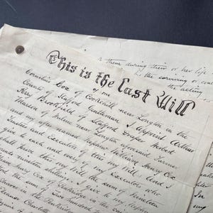 May include: A vintage document with the heading This is the Last Will of me written in black ink on aged, off-white paper. The text is handwritten in cursive script, detailing legal bequests and names such as Cornelius Cox and Arthur Perry.
