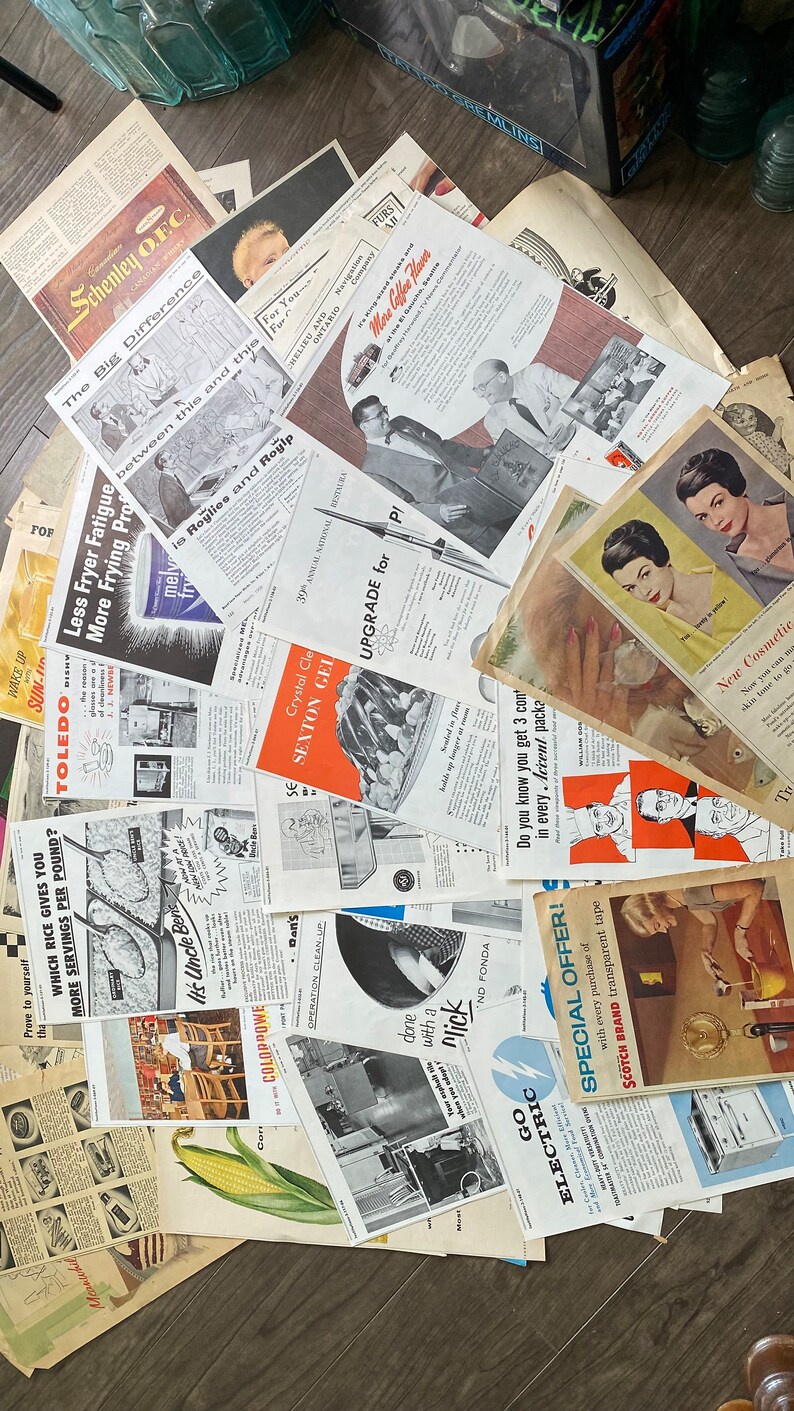 May include: A collection of vintage advertisements and ephemera, featuring various products and services. The papers display a range of colors, with text and illustrations. The ads include text such as "Schenley O.F.C.", "Crystal Gel", and "Go Electric".
