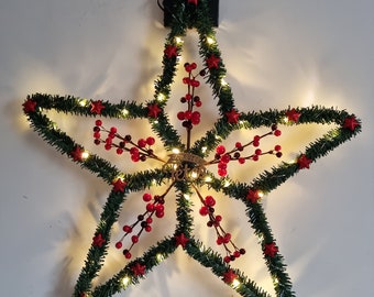 Star in traditional bright fir decorated with holly and red stars "HOLLY STAR"