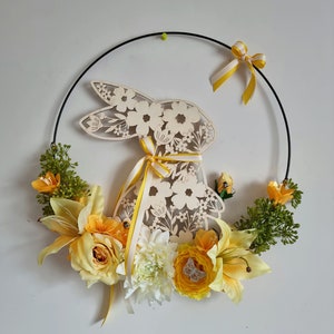 Black metal circle decorated for Easter with a wooden rabbit, a lotus, lilies, roses and greenery VIVE LE PRINTEMPS image 1