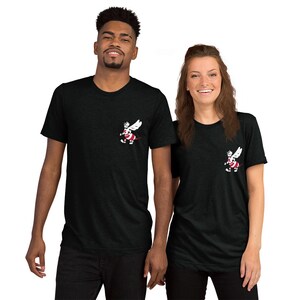 May include: Two people wearing black t-shirts with a white cartoon bee graphic on the left chest. The bee is wearing red and white stripes.