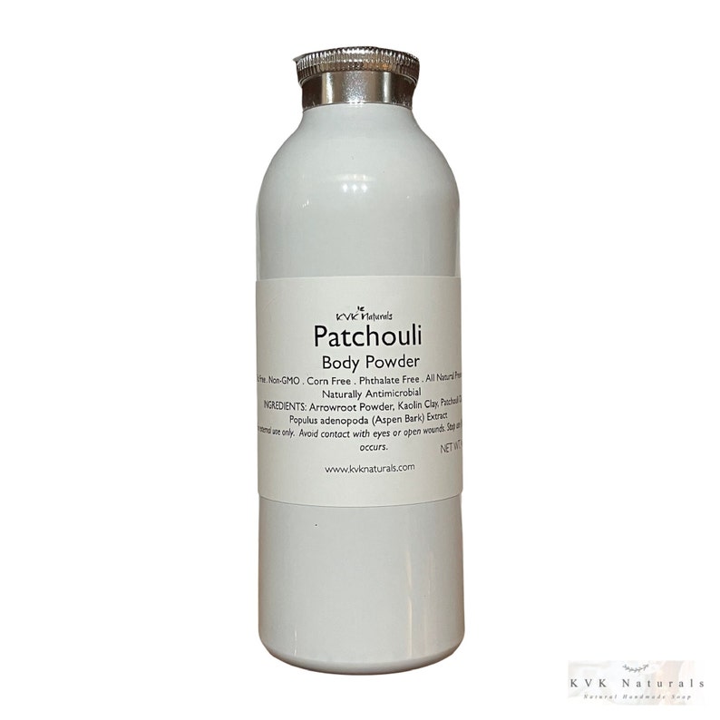 May include: A white bottle of KVK Naturals Patchouli Body Powder with a silver lid. The label includes the product name, ingredients, and website address. The powder is non-GMO, corn-free, and phthalate-free.