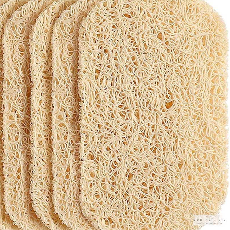 May include: A stack of rectangular, beige soap savers made of a woven, loofah-like material. The soap savers have a textured, open weave design. The KVK Naturals logo is visible in the bottom right corner.