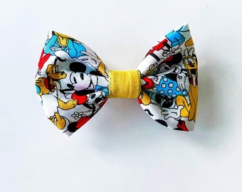 Disney inspired bow with alligator clip or nylon headband. Mickey, Minnie, Pluto, Donald, and Daisy baby hair bow