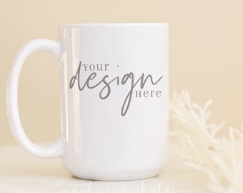 May include: White ceramic mug with a large handle. The mug has the text "Your design here" printed on the front.