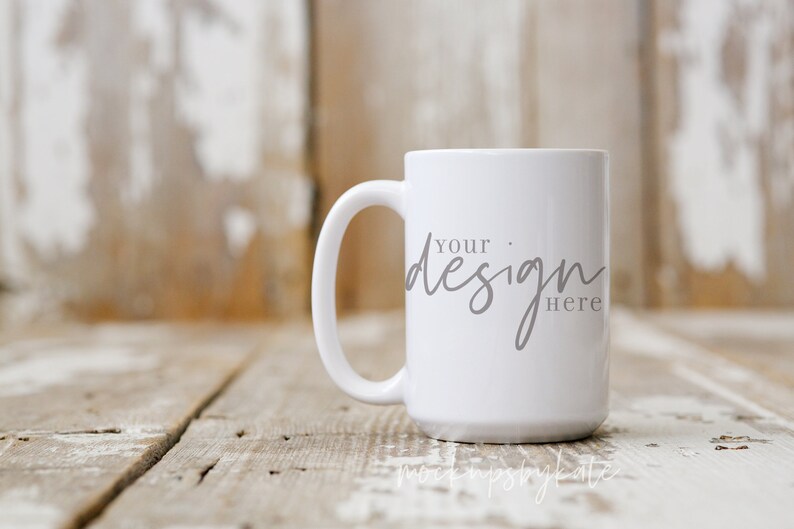 May include: White ceramic mug with a black handle. The mug has the text "Your design here" printed on the front.